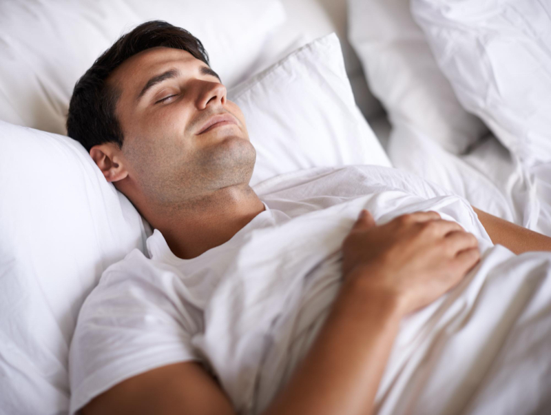 Man resting comfortably while on a business trip, and staying healthy.