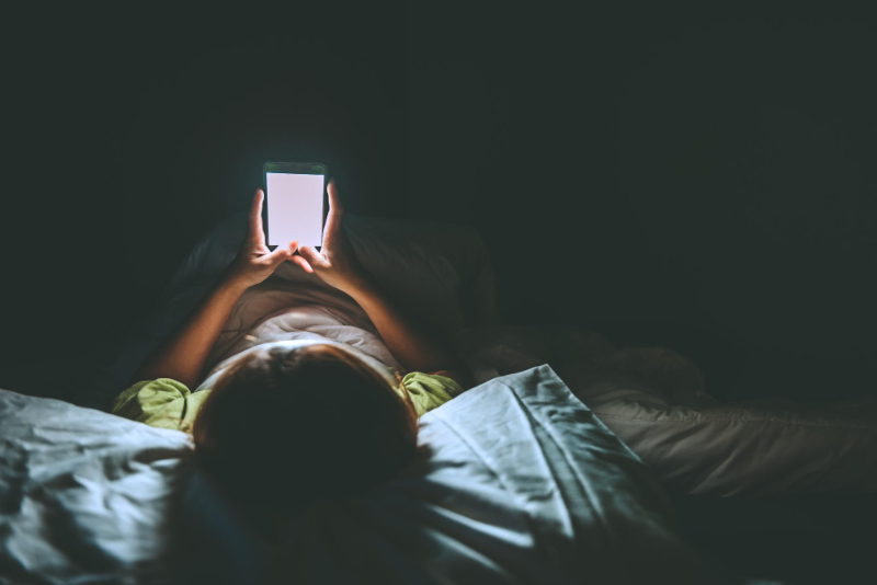 Smartphones and other electronics with screens emit blue light which interferes with melatonin and can interrupt better sleep.